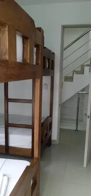 a bunk bed in a room with a staircase at Casa de Playa frente al mar. in Coveñas