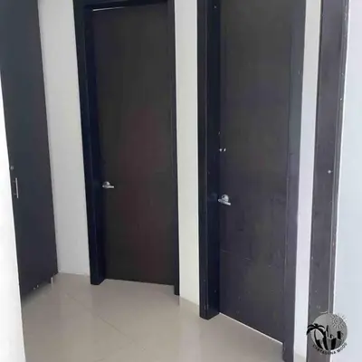 two black doors in a room with at Cartagena apartamento in Cartagena de Indias