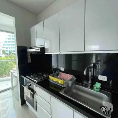 a kitchen with a sink and a stove top oven at Cartagena apartamento in Cartagena de Indias