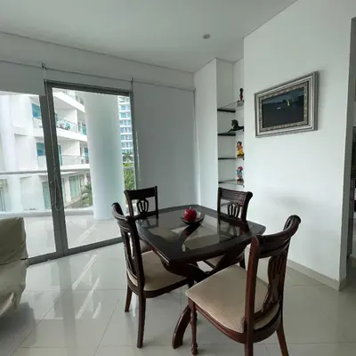 a dining room with a glass table and chairs at Cartagena apartamento in Cartagena de Indias