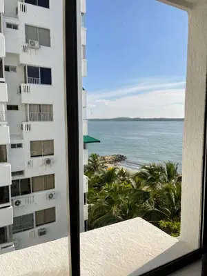 a view of the ocean from a hotel window at Hermoso Apartamento, con vista al mar, en Cartagena de Indias, dos cuartos in Cartagena de Indias
