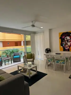 a living room with a couch and a table at Hermoso apartamento en la mejor zona de la ciudad in Cartagena de Indias