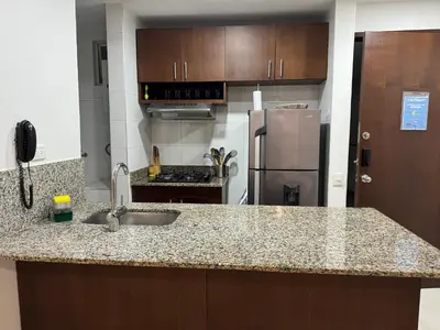 a kitchen with a sink and a refrigerator at Hermoso apartamento en la mejor zona de la ciudad in Cartagena de Indias