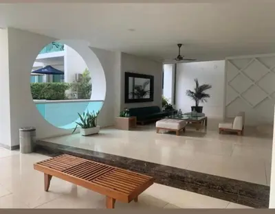 a living room with a couch and a table at Hermoso apartamento en la mejor zona de la ciudad in Cartagena de Indias