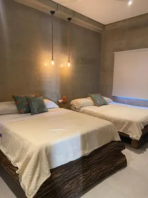 a room with two beds in a room at Sea La Vie in San Bernardo del Viento