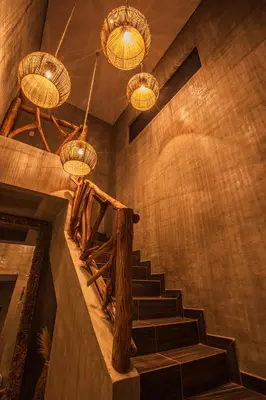 a staircase in a room with chandeliers at Sea La Vie in San Bernardo del Viento