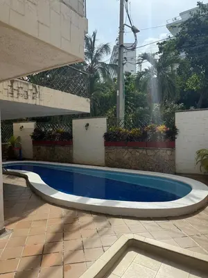 a swimming pool in the middle of a courtyard at A metros de las playas de Bello Horizonte y de Centro Comercial Zazue in Santa Marta