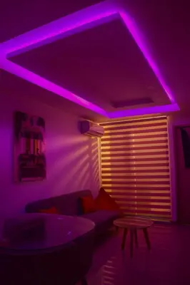 a living room with purple lights on the ceiling at Luxury apartamento ubicación central y piscina. in Cartagena de Indias
