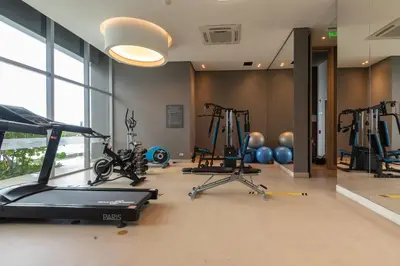 a gym with bikes and exercise equipment in a room at Beachfront Paradise with Outstanding Sunset Views in Cartagena de Indias