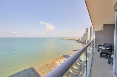 a view of the beach from the balcony of a building at Beachfront Paradise with Outstanding Sunset Views in Cartagena de Indias
