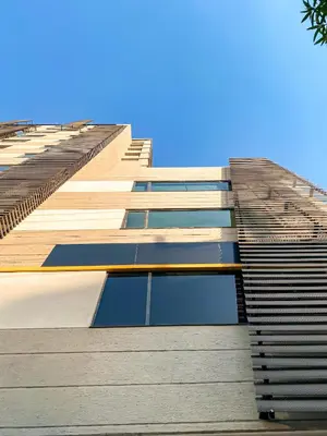 a tall building with many windows on the side of it at Gz Tower Apartamento Barranquilla in Barranquilla