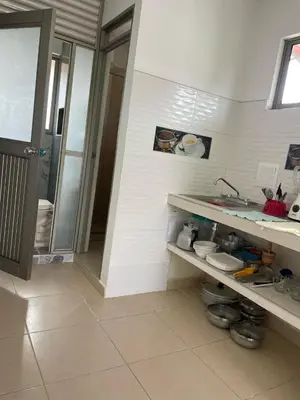 a bathroom with a sink and a counter with dishes at Cabañas Melany in Coveñas