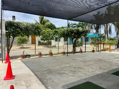 a group of orange cones in a parking lot at Cabañas Melany in Coveñas