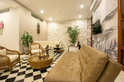 a living room with a couch and a checkered floor at San Pedro Claver Luxury in the walled city in Cartagena de Indias