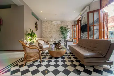 a living room with a couch and chairs at San Pedro Claver Luxury in the walled city in Cartagena de Indias