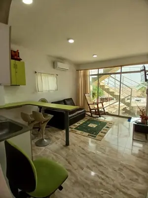 a living room with a ping pong table and chairs at Casa Playa Arreboles in Cartagena de Indias