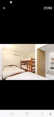 two pictures of a bedroom with a bed and a mirror at Casa Playa Arreboles in Cartagena de Indias