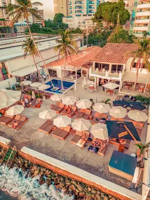 an aerial view of a resort with chairs and umbrellas at Wala Hotel and Beach Club in Cartagena de Indias