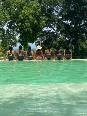 a group of women in bikinis sitting in a swimming pool at ADA MARINA, hotel campestre con la mejor vista a Cartagena in Turbaco