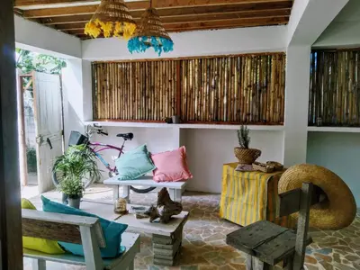 a living room with a couch and a table at Quatro palos in Rincón
