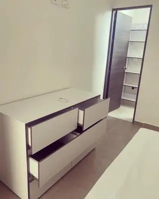a white bathroom with a sink and a mirror at Murano Hotel in Coveñas