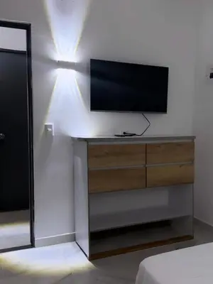 a television on a dresser in a room at Murano Hotel in Coveñas