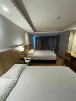 a hotel room with a large bed and a window at Wyndham Garden Cartagena in Cartagena de Indias