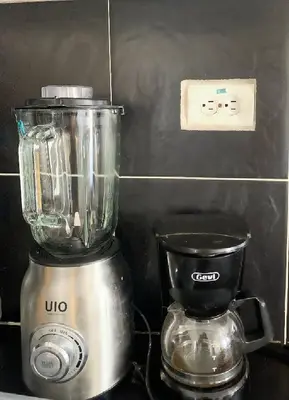 a blender sitting on top of a counter at ARMANI in Puerto Colombia