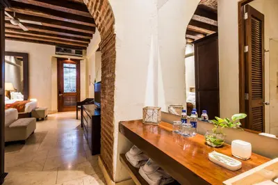 a living room with a table and a couch at Ananda Hotel Boutique in Cartagena de Indias