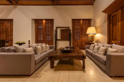 a living room with two couches and a coffee table at Ananda Hotel Boutique in Cartagena de Indias