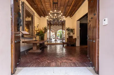 a hallway of a home with a chandelier at Ananda Hotel Boutique in Cartagena de Indias
