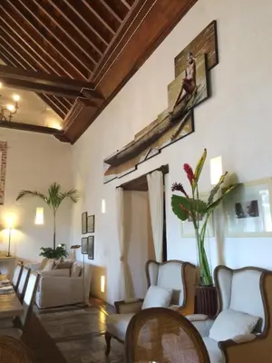 a living room with white furniture and a ceiling at Hotel Boutique Casa del Coliseo in Cartagena de Indias