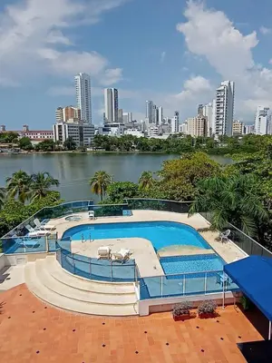 a large swimming pool with a city in the background at Hermoso y amplio apartamento en Cartagena de Indias in Cartagena de Indias