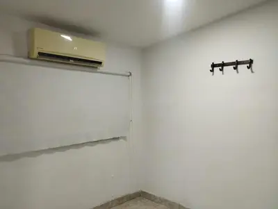 a room with a white wall with a air conditioner at Apartamentos San Felipe in Cartagena de Indias