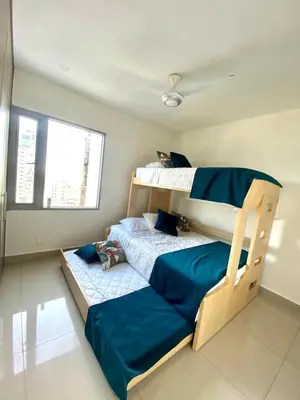 a bedroom with two bunk beds and a window at 19TH FLOOR LUXURY APARTMENT BAY VIEW CARTAGENA in Cartagena de Indias
