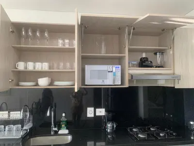 a kitchen with a microwave and a counter top at 19TH FLOOR LUXURY APARTMENT BAY VIEW CARTAGENA in Cartagena de Indias