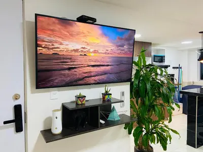 a large flat screen tv hanging on a wall at Apartamento Exclusivo - Caribe Campestre Coveñas in Coveñas