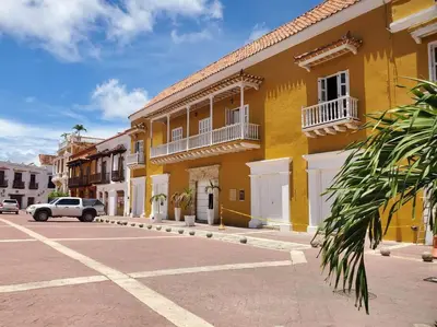 a yellow building on the side of a street at Apartamento con VISTA AL MAR, A una cuadra de la PLAYA. Piso 16 in Cartagena de Indias