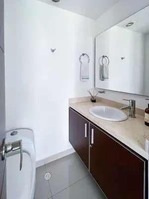 a bathroom with a sink and a toilet and a mirror at 1 Bedroom Apartment Morros. Beach access in Cartagena de Indias