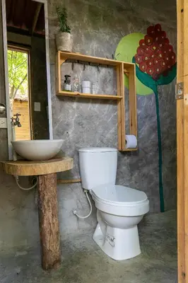 a bathroom with a toilet and a sink at Hostal Campomar in Santa Veronica