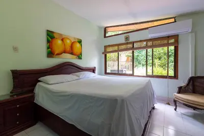 a bedroom with a bed and a window at Hostal Campomar in Santa Veronica