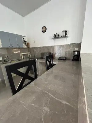 a kitchen with a counter and a counter top at ALTAVITA apart completo a 100 m del mar in Puerto Colombia
