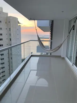 a balcony with a hammock on top of a building at Edificio kuali apto 1704 in Santa Marta