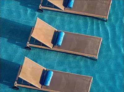a group of chairs sitting on top of a table at Edificio kuali apto 1704 in Santa Marta