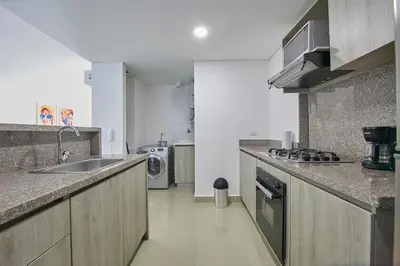 a kitchen with a sink and a counter top at Artsy Oceanview Condo W Incredible Rooftop Pool in Cartagena de Indias