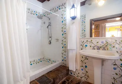 a bathroom with a sink and a tub and a shower at Casa Baloco in Cartagena de Indias
