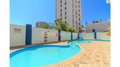 a large swimming pool in the middle of a building at Santa Marta, Hermoso Apartamento Ubicado en Bello Horizonte in Santa Marta