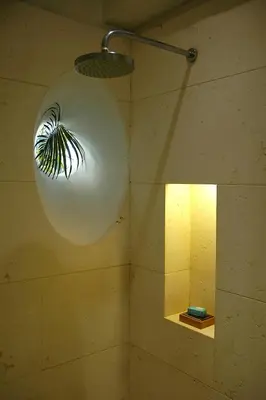 a large white orb hanging from the ceiling of a bathroom at Hotel Casa Don Sancho By Mustique in Cartagena de Indias