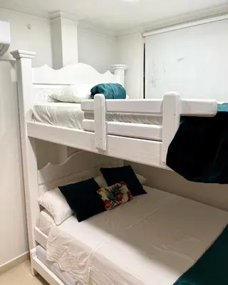 two white bunk beds in a room at Casa Dimares in Cartagena de Indias