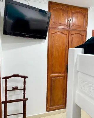 a flat screen tv hanging on a wall at Casa Dimares in Cartagena de Indias